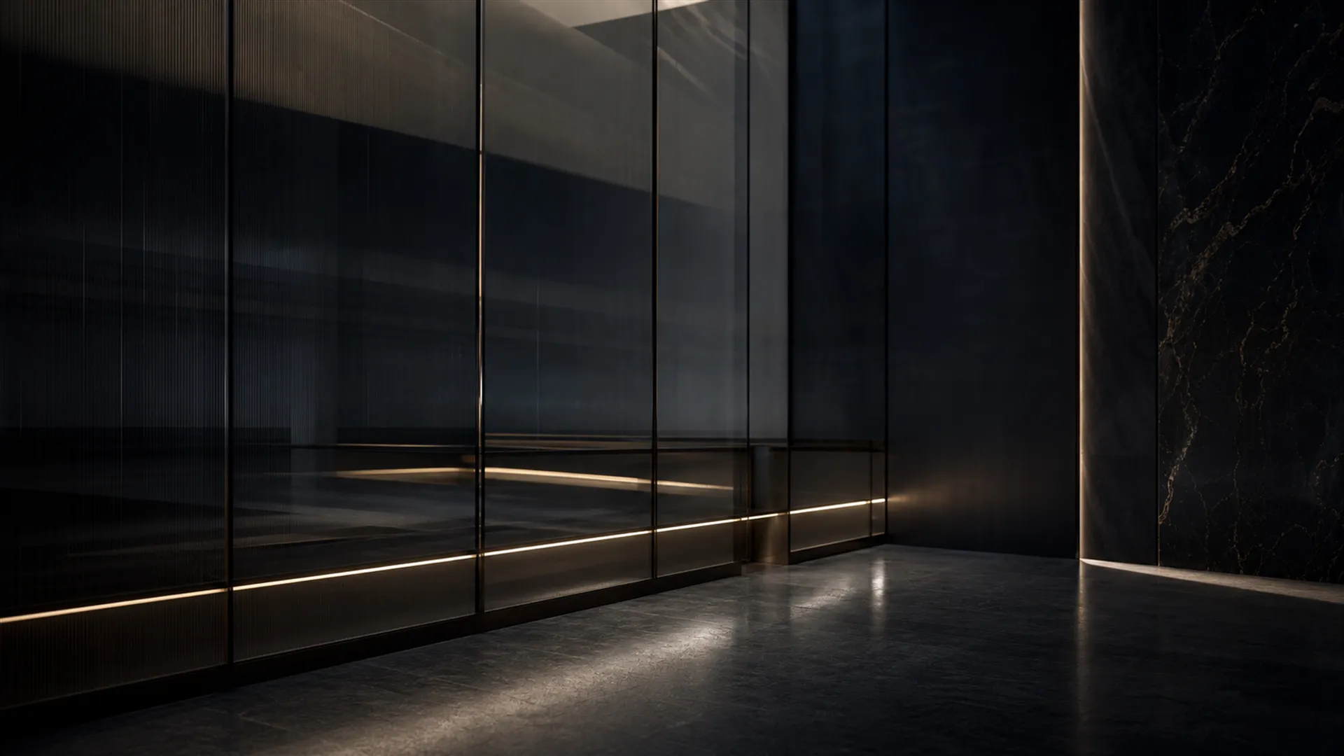 Dark fluted glass and stone corridor with a thin line of warm light